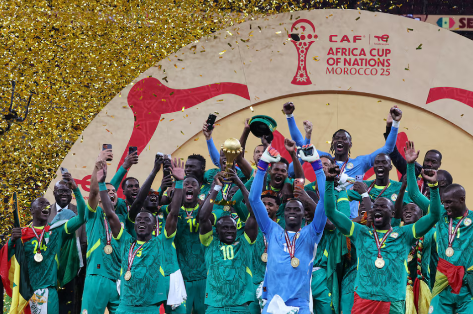 Senegal players lifting the AFCON trophy after winning Senegal vs Morocco.