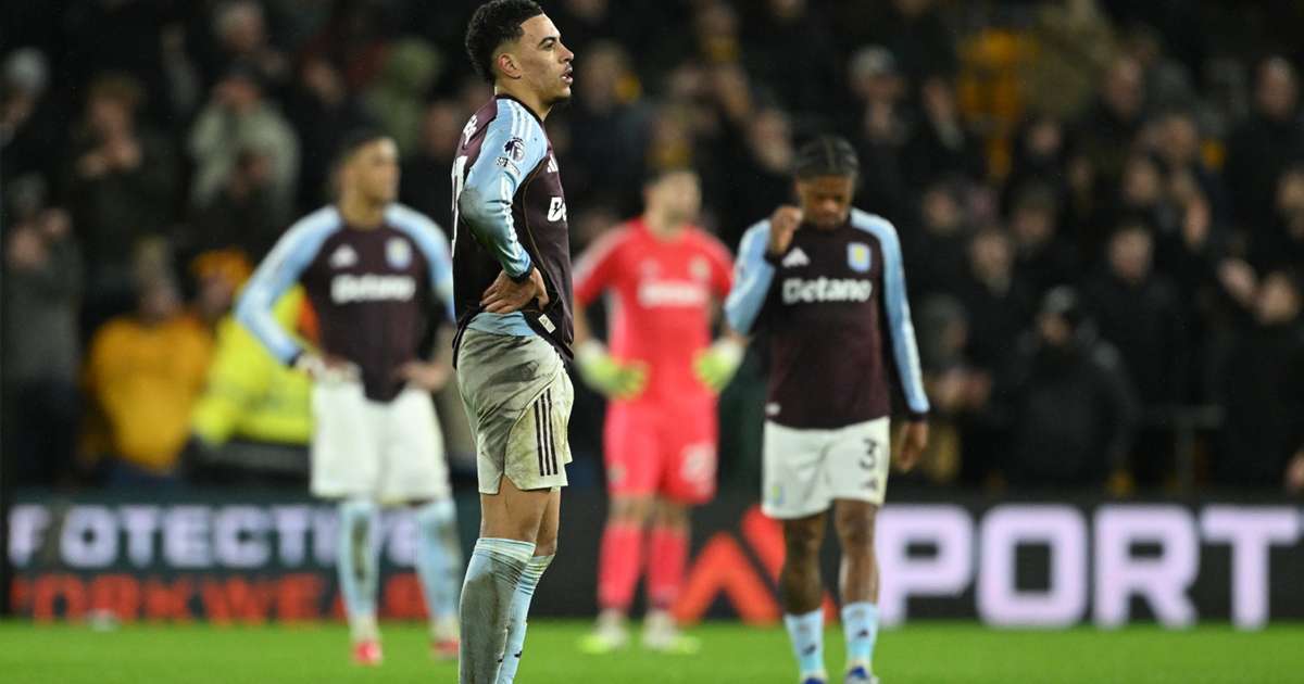 Aston Villa top four blow visualized as Morgan Rogers stands dejected on the pitch.