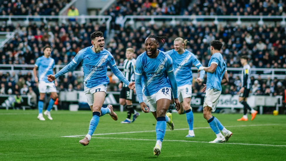 Phil Foden and Erling Haaland run to celebrate with Antoine Semenyo after his goal in the Carabao Cup semi-final.